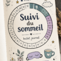 Close-up of a bullet journal open with sleep tracking pages and a cozy setting.