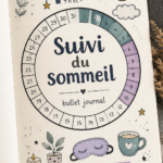 Close-up of a bullet journal open with sleep tracking pages and a cozy setting.